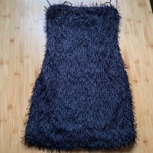 It’s that cute, little black dress.  NWT, form fitting.